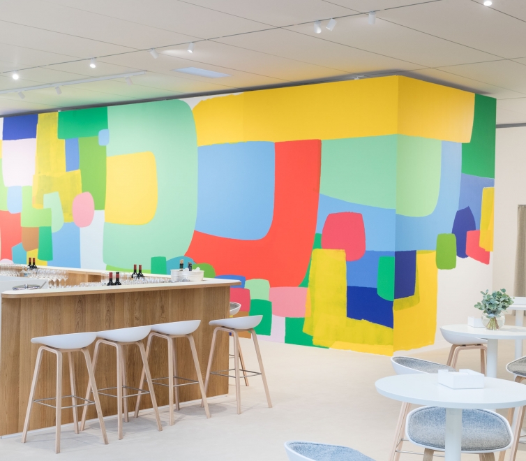 Brightly colored abstract mural by Federico Herrero installed in UBS Lounge